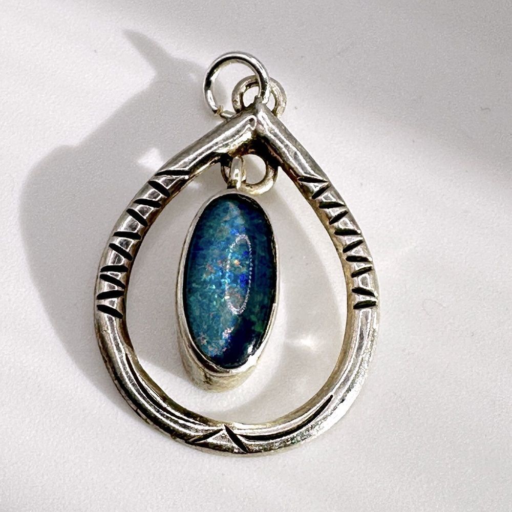 Marked Sterling silver (HTS) and opal in resin pendant!